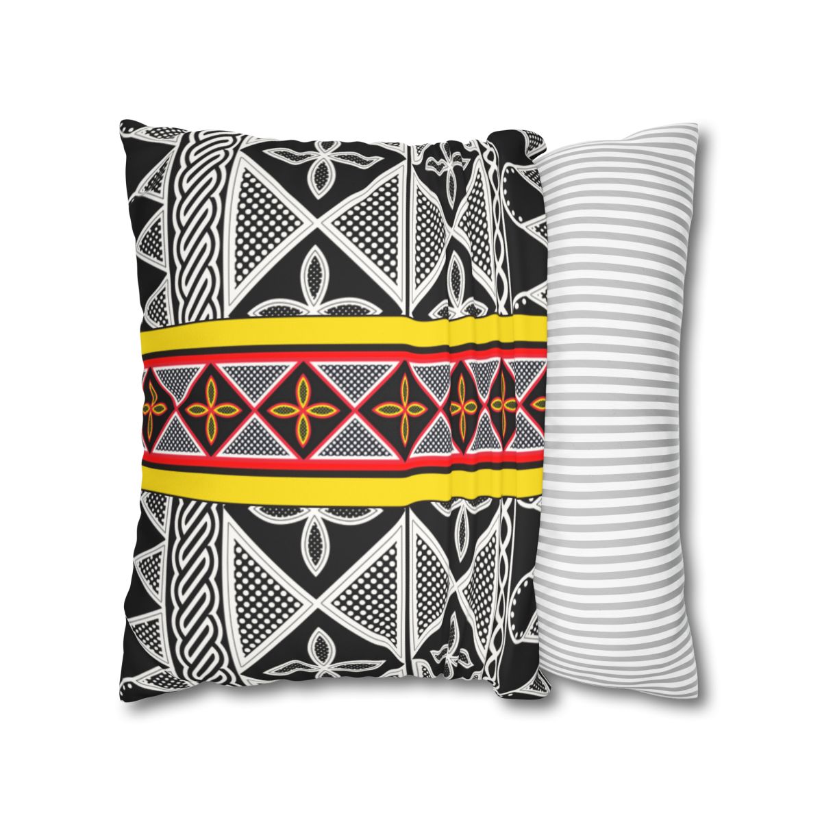 a decorative pillow with a black and white geometric pattern, accented by a yellow stripe. The pillow is placed next to a matching gray and white striped pillow, creating a visually appealing contrast.