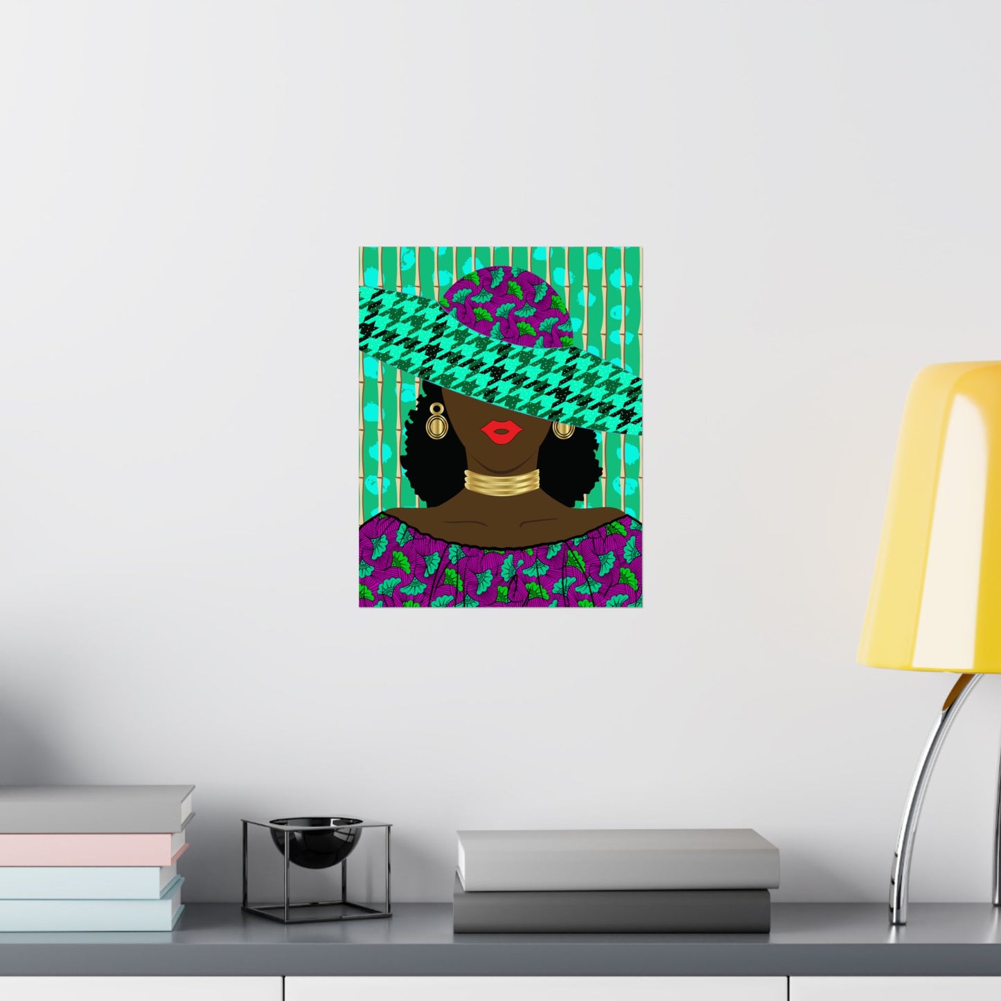 a colorful abstract artwork of a woman's face, with a green and purple patterned hat and a purple dress, displayed on a wall above a shelf with books and a lamp.