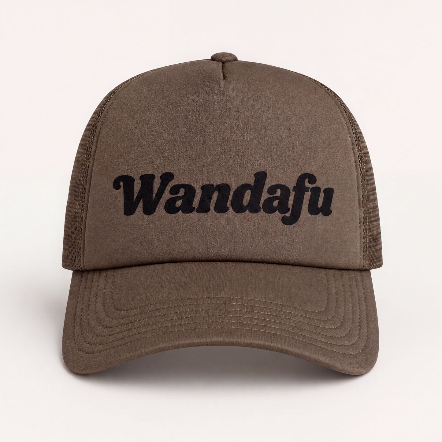 A brown baseball cap with the text "Wandafu" printed on it.