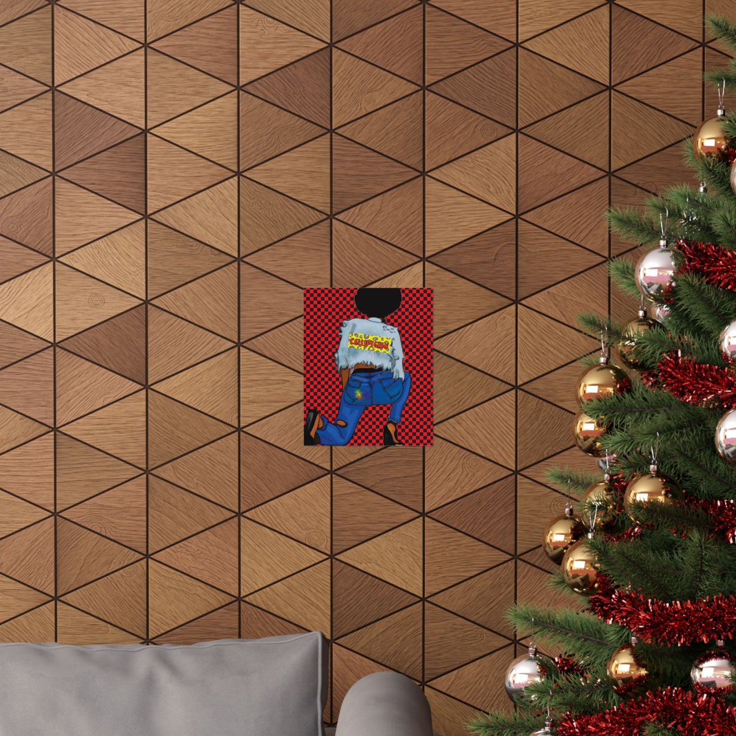 a cozy living room with a Christmas tree adorned with red and gold ornaments, and a gray couch in the background. A framed artwork or poster is hanging on the wall, adding a decorative touch to the room.