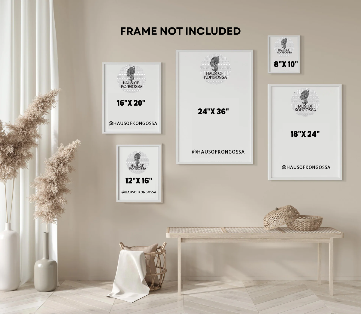 a minimalist interior design with a white table and a beige curtain. There are four framed artworks of varying sizes displayed on the wall, with the largest one being 24" x 36". The other three are smaller, with one being 12" x 16" and the other being 18" x 24". The artworks are arranged in a grid-like pattern, creating a visually appealing display.