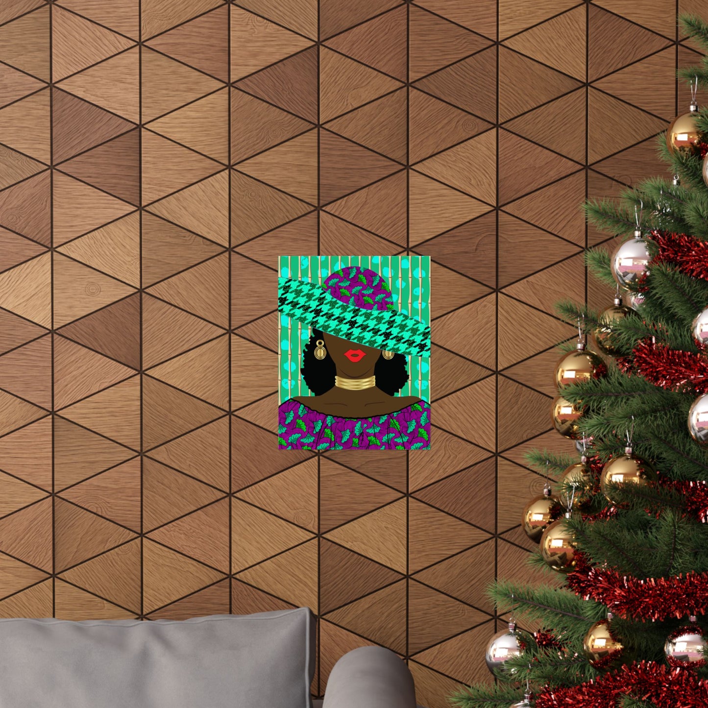 a cozy living room with a Christmas tree adorned with ornaments and tinsel, and a poster of a woman wearing a hat with a colorful pattern hanging on the wall.