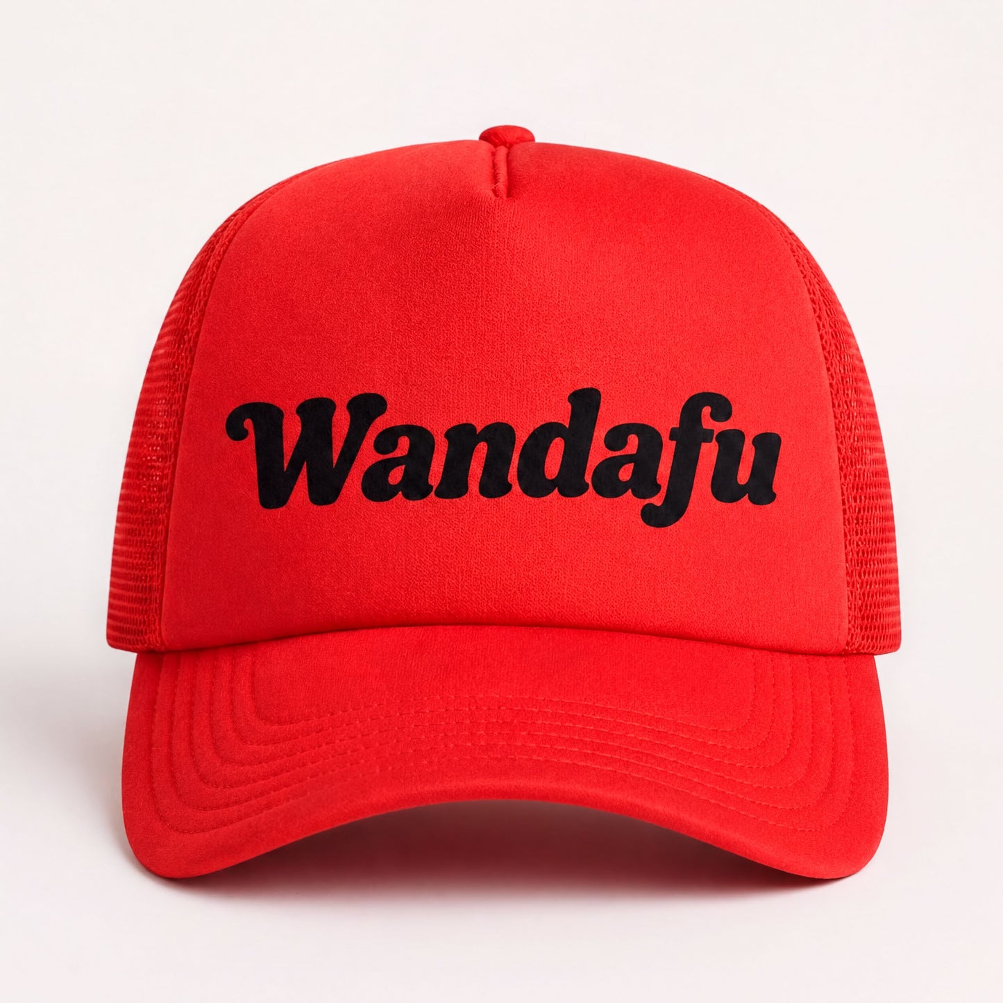 A red baseball cap with the text "Wandafu" printed on it.
