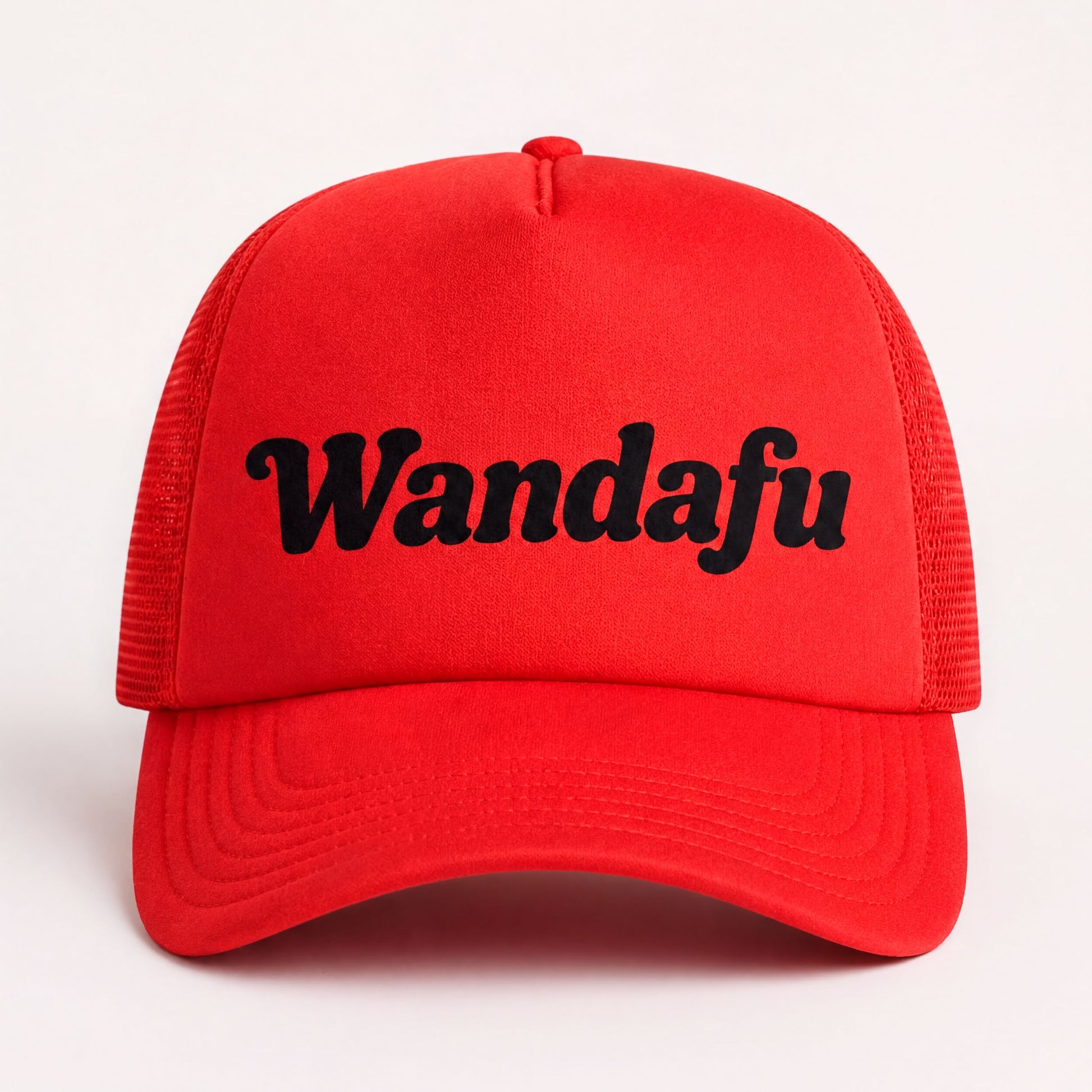 A red baseball cap with the text "Wandafu" printed on it.