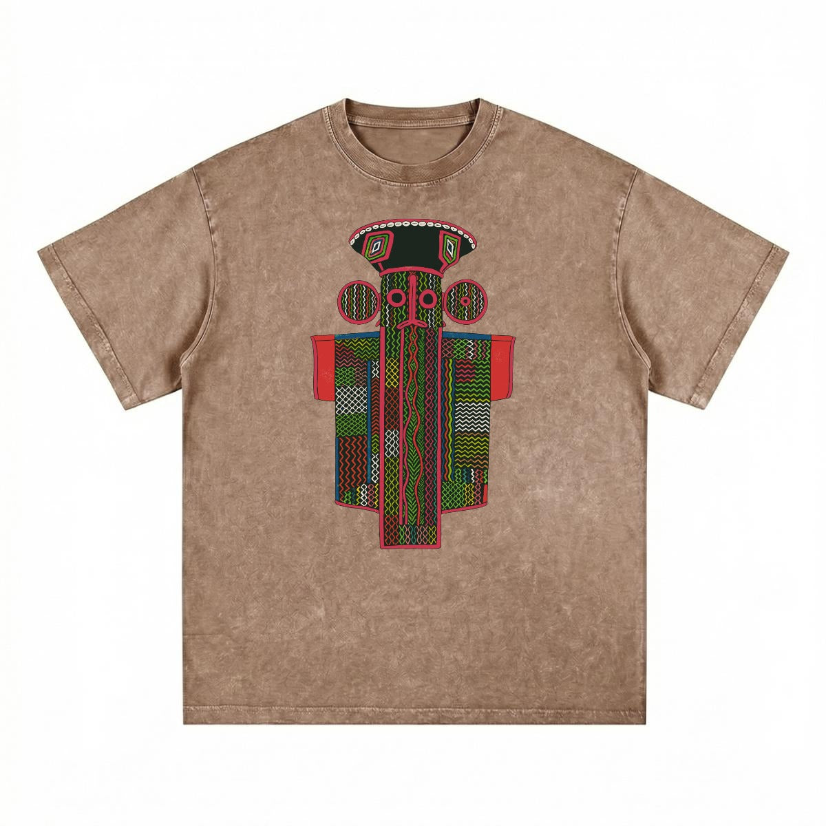 A brown t-shirt with a colorful, abstract design featuring a stylized figure or mask with various geometric shapes and patterns in red, green, and black.
