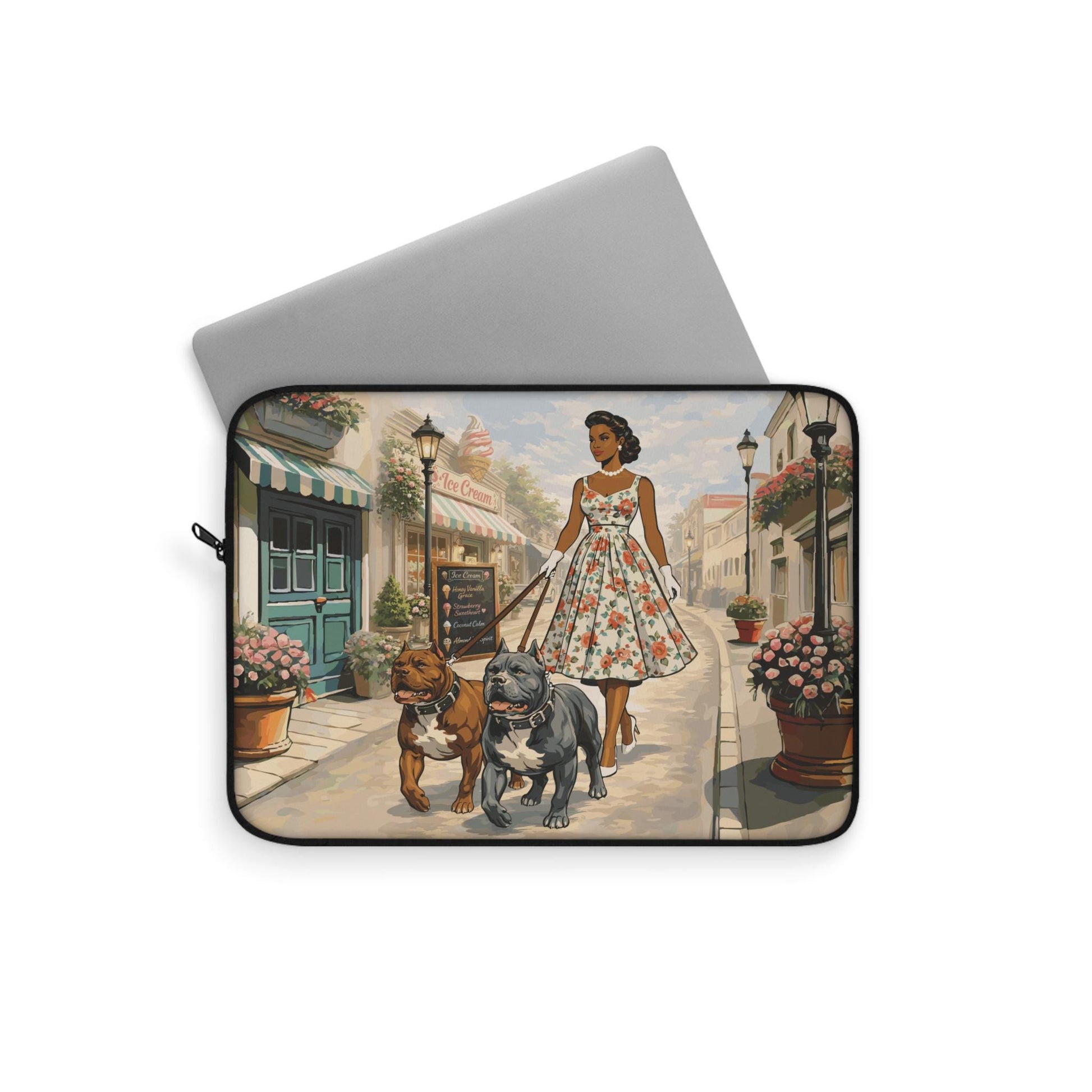 A woman in a floral dress is walking two dogs down a street lined with flower pots and buildings.