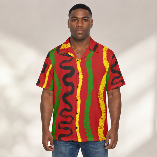 A man wearing a red, green, and yellow striped shirt with a unique abstract pattern.
