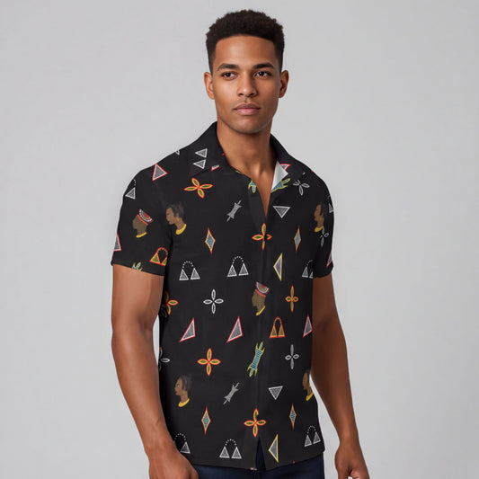 A man wearing a black shirt with a colorful geometric pattern.