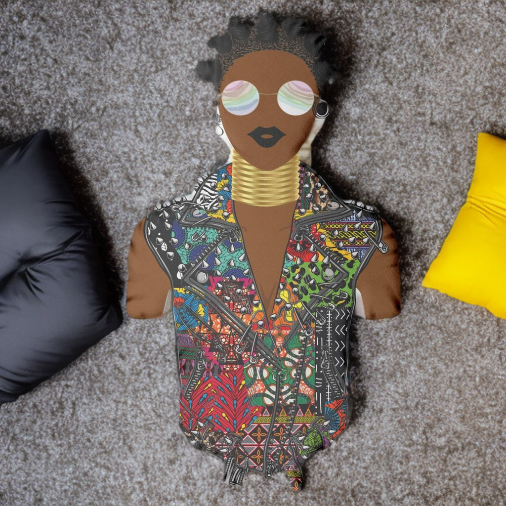 A colorful, patterned doll with a unique design, including a face with large sunglasses and a vibrant, multicolored jacket.