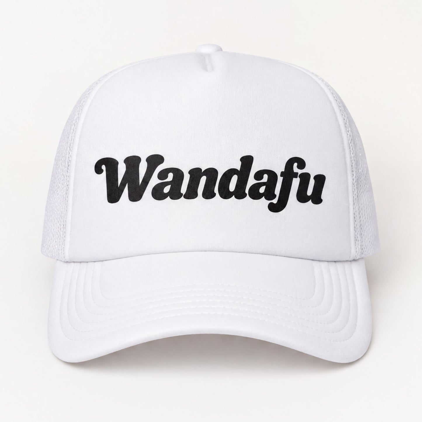 A white baseball cap with the text "Wandafu" printed on it.
