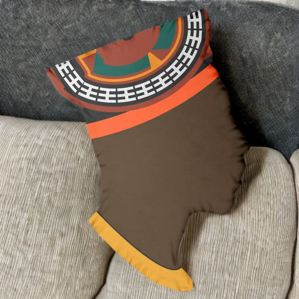 A pillow with a colorful, abstract design resembling a face or profile of a person.