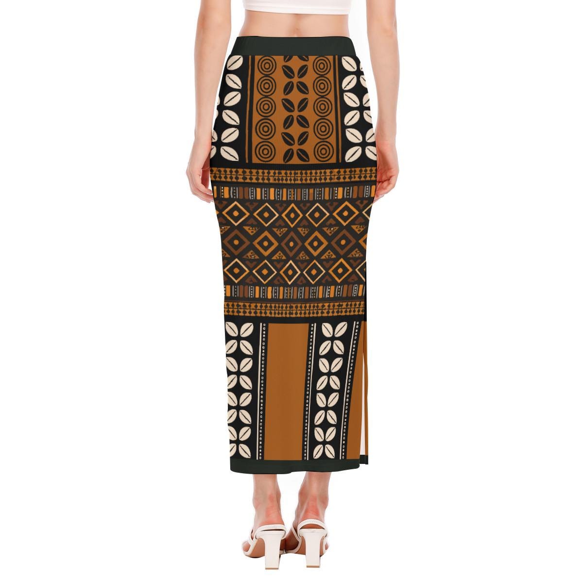 a woman wearing a long skirt with a patterned design.