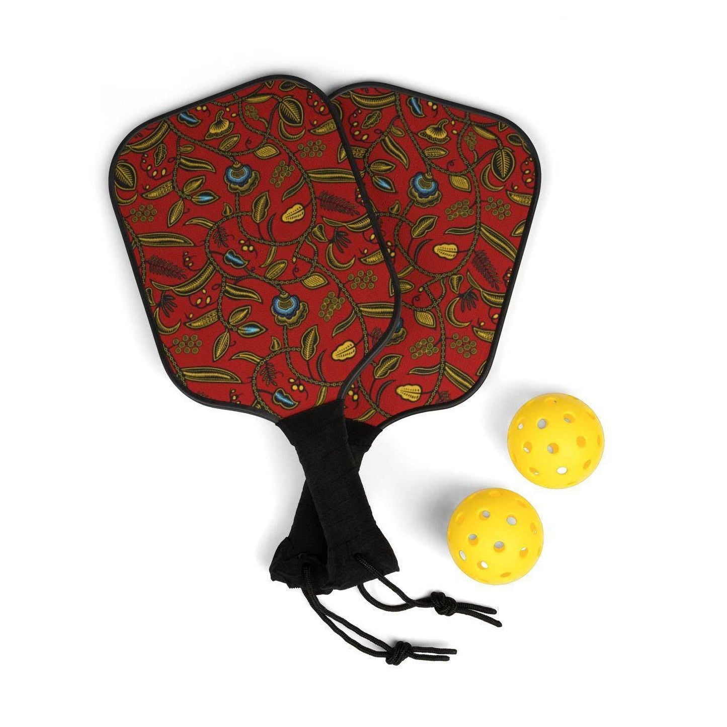 two red paddleball rackets with a floral pattern and two yellow paddleball balls.