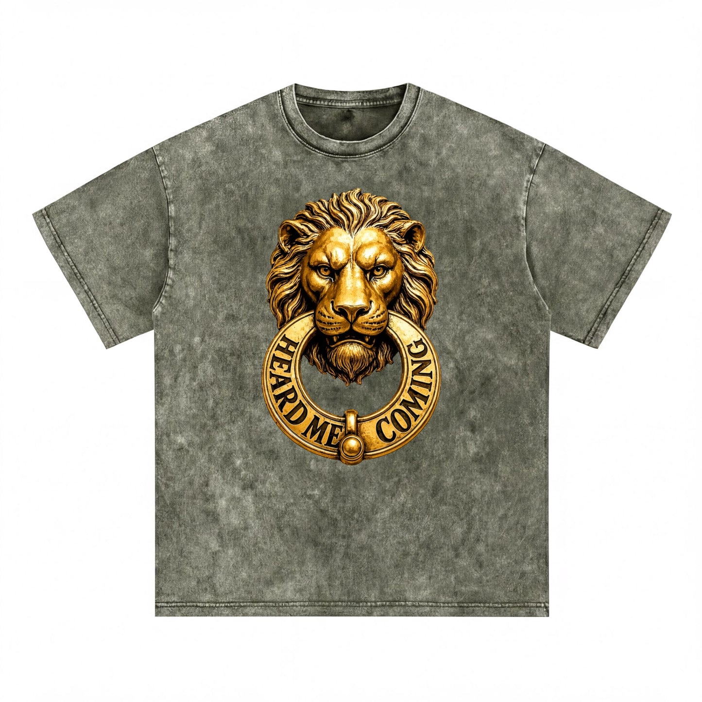 A gray t-shirt with a gold lion's head design and the text "HEARD ME COMING" printed on it.