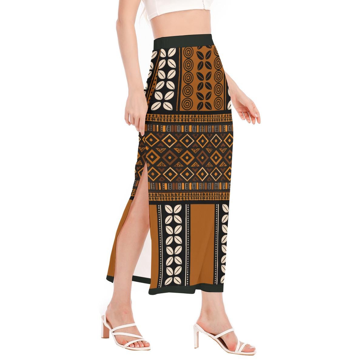 A woman wearing a long skirt with a patterned design, standing against a white background.