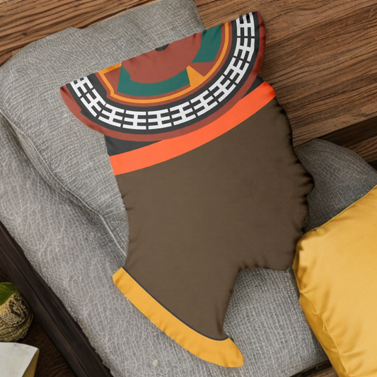 A decorative pillow with a colorful, abstract design is placed on a gray couch.