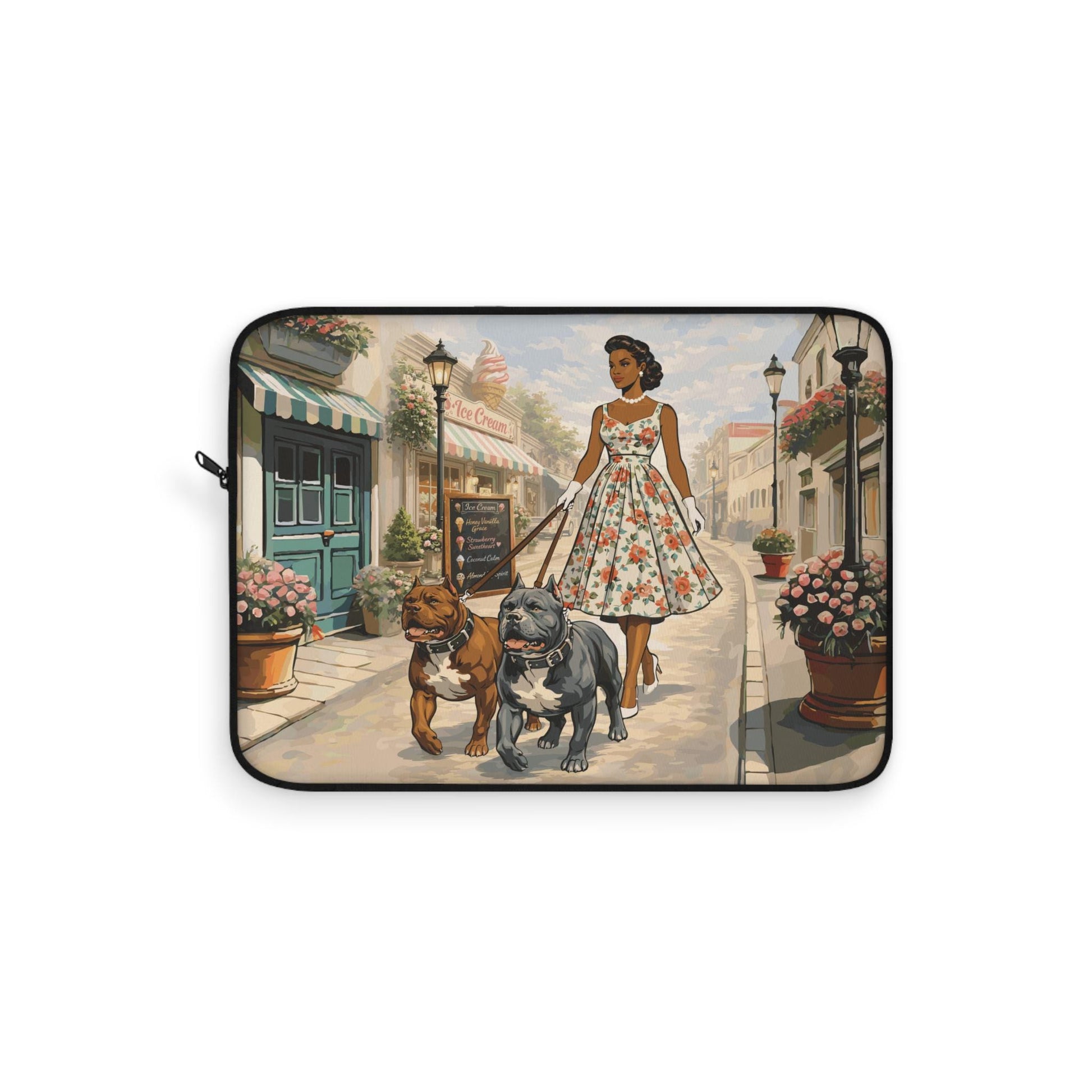 A woman in a floral dress is walking two dogs down a street lined with flower pots and buildings.