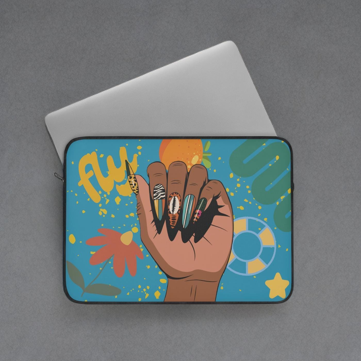 a laptop sleeve with a colorful and artistic design, including a hand with painted nails, flowers, and other decorative elements.