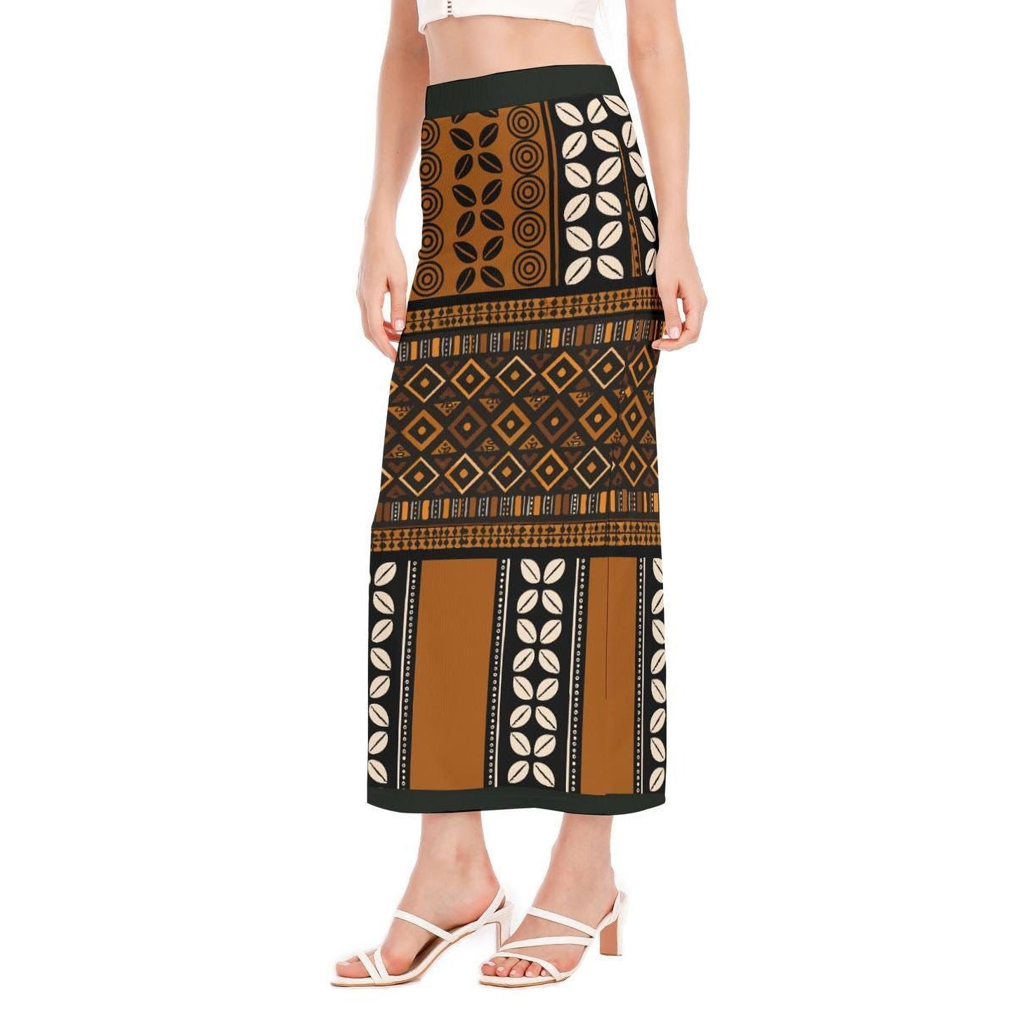 A woman wearing a long skirt with a patterned design, including a mix of geometric shapes and floral elements.
